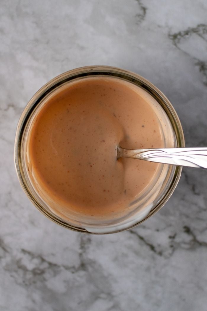 mayo, ranch and hot sauce are stirred to make a delicious wrap sauce